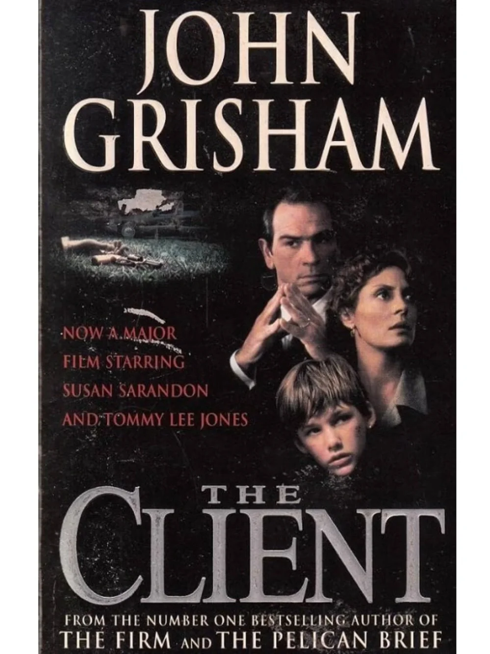 “The Client” a paperback novel by John Grisham